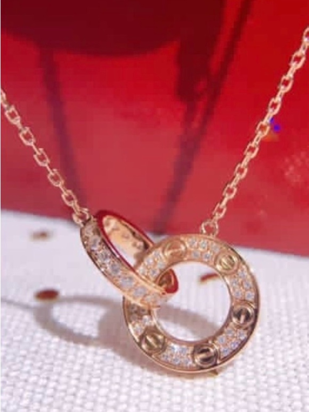 Rose Gold Interlocking Circle Pendant Necklace .
